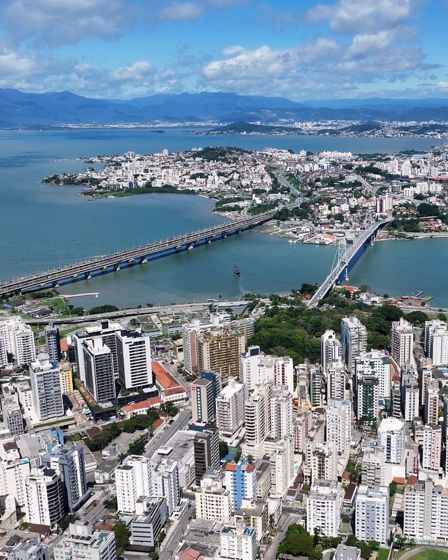 Aerial view of Florianópolis, Brazil, with the Hercílio Luz and Colombo Salles bridges crossing the bay to the mainland