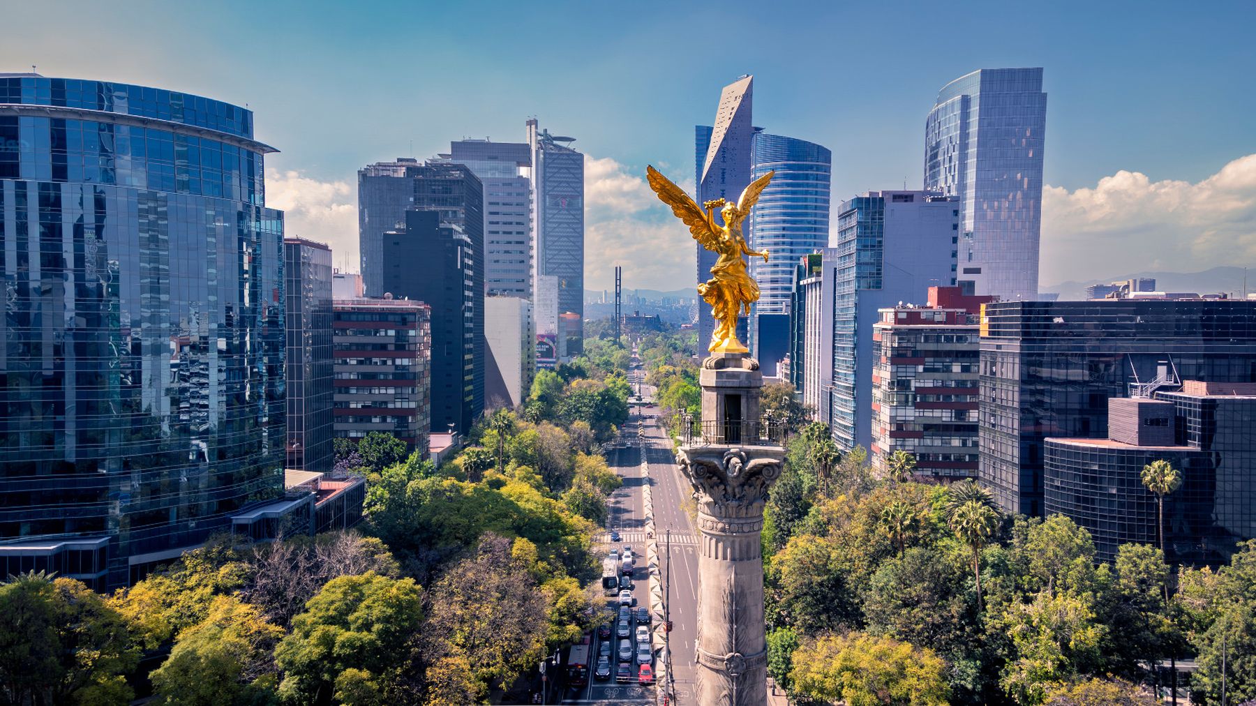The Ángel de la Independencia on Paseo de la Reforma, Mexico City, with the city's office towers behind it